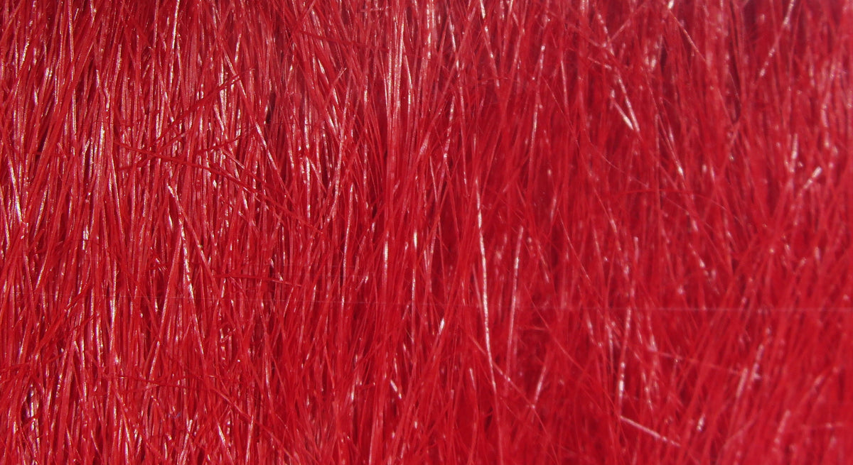 Bright red Hareline craft fur close-up showing glossy, long synthetic fibers for fly tying